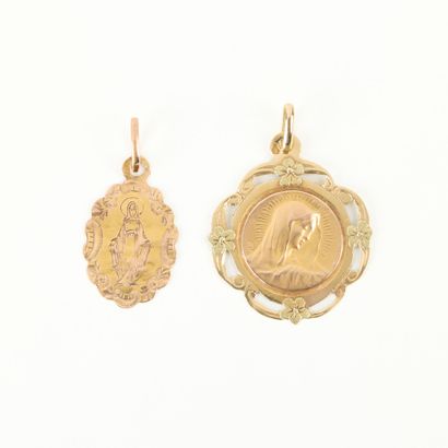 2 engraved gold medals of the Virgin Mary....