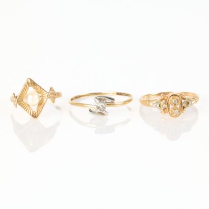 Three gold girls' rings set with pearls or...