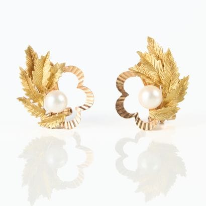 Pair of gold flower and foliage ear clips...