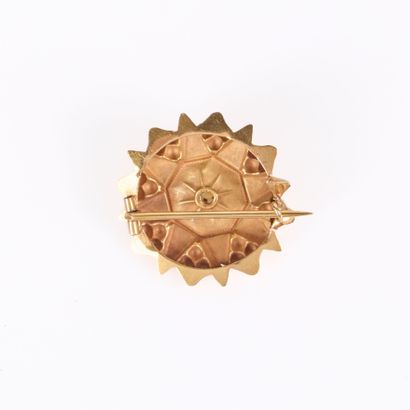 Gold star brooch set with a cultured pearl....