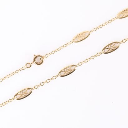 Gold chain (750‰), round mesh interspersed...