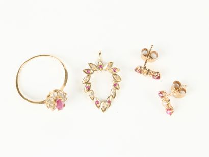 Set of gold jewelry set with small red and...