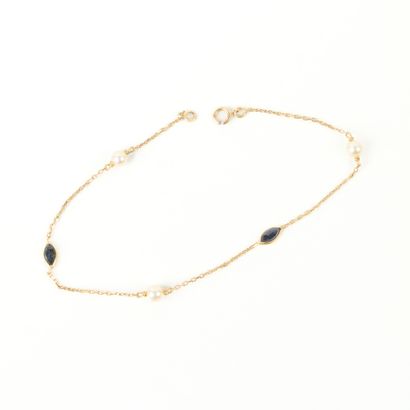 Gold bracelet set with 3 cultured pearls...