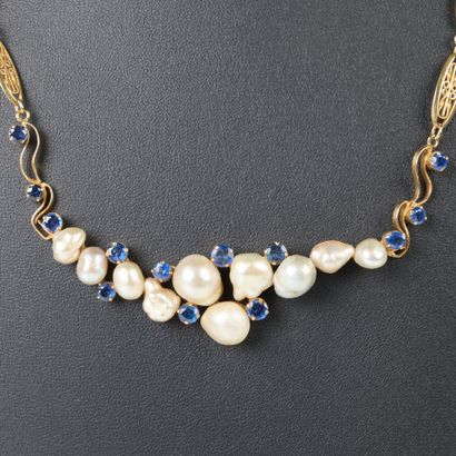 Gold necklace, filigree-link chain holding...