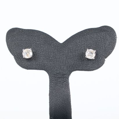 Pair of gold ear studs, each set with a round...