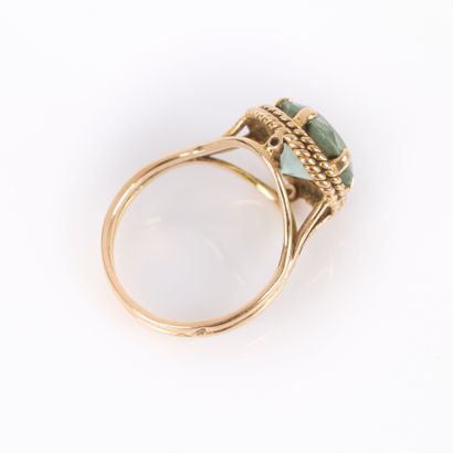 Gold ring set with a fine blue stone (wear),...