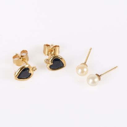 Pair of gold stud earrings each set with...