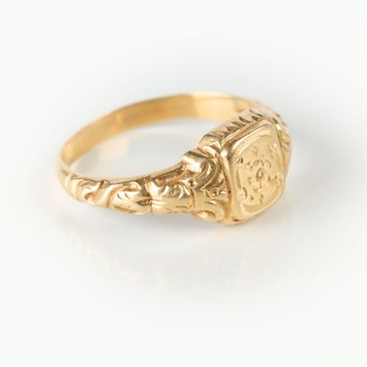Gold ring engraved with a pansy and foliage....