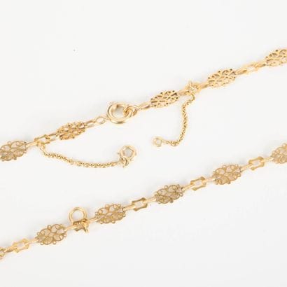 Openwork gold sautoir, forming a double-row...