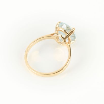 Gold ring set with an oval aquamarine. TDD...