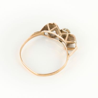 Two-tone gold ring set with a white stone....