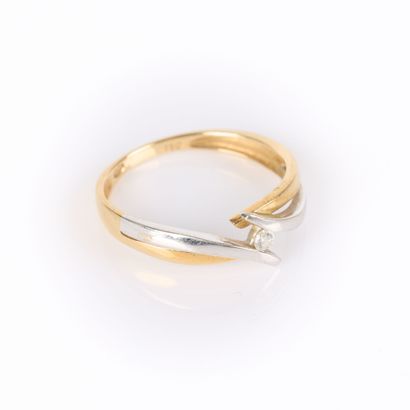 Two-tone gold cross ring set with a brilliant-cut...