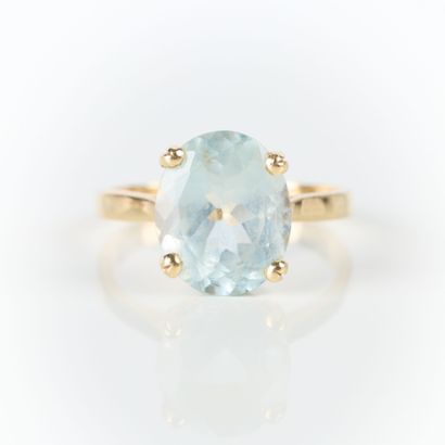 Gold ring set with an oval aquamarine. TDD...
