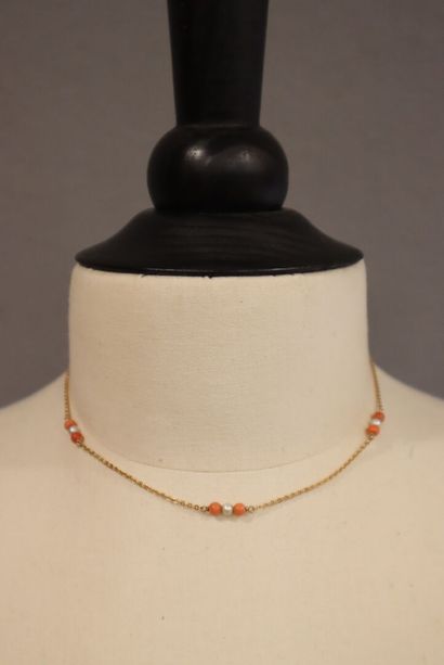 Yellow gold chain with coral and cultured...