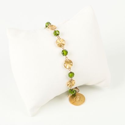 Gold rosary bracelet (750‰), adorned with...