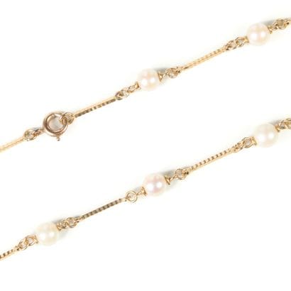 Gold necklace, baton links alternating with...