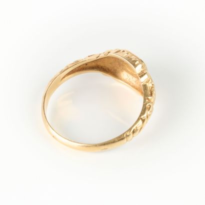 Gold ring engraved with a pansy and foliage....