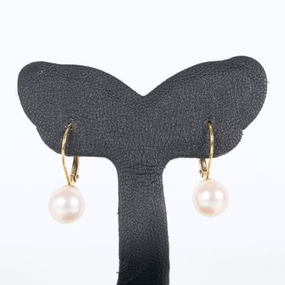 Pair of gold (750‰) earrings, each set with...