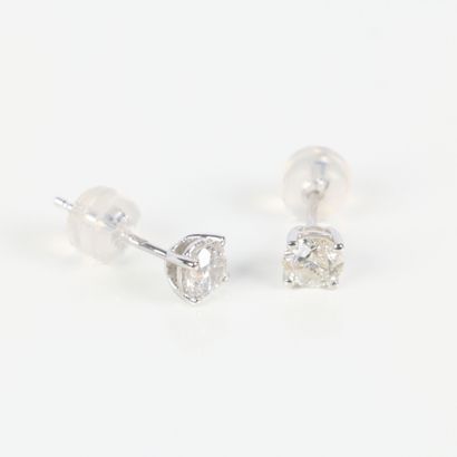 Pair of gold ear studs, each set with a round...