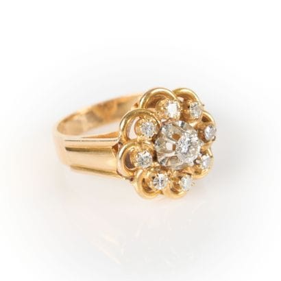 Gold and platinum ring centered on a diamond...