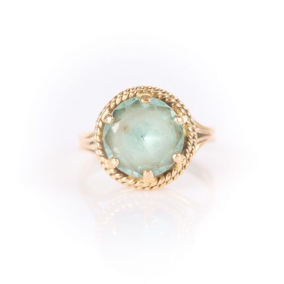Gold ring set with a fine blue stone (wear),...