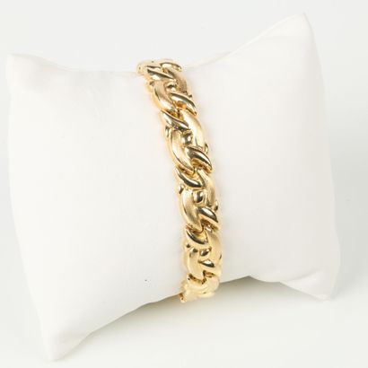 Fancy matte and polished gold link bracelet....