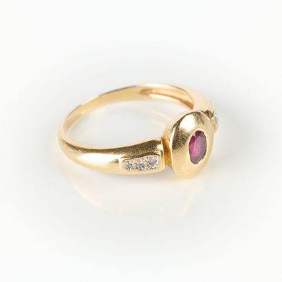 Gold ring set with an oval ruby (worn) with...