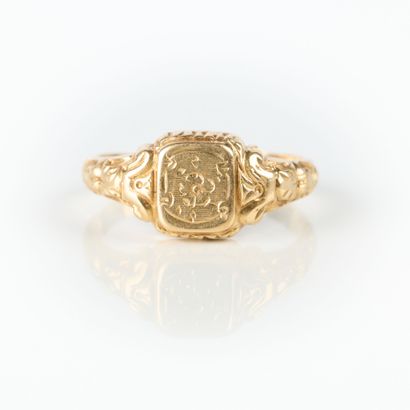 Gold ring engraved with a pansy and foliage....
