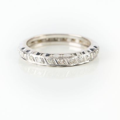 Wedding band in white gold set with small...