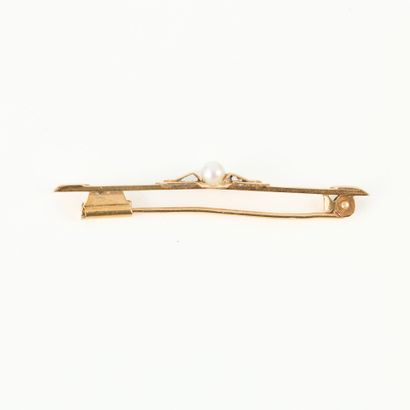 Gold barrette brooch set with a small cultured...
