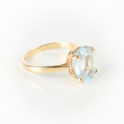 Gold ring set with an oval aquamarine. TDD...