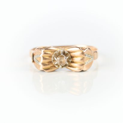 Two-tone gold ring set with a white stone....