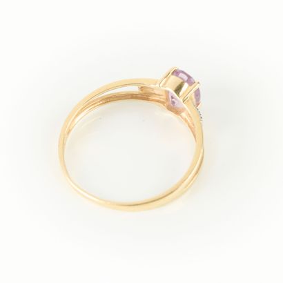 Gold ring set with an oval amethyst. TDD...