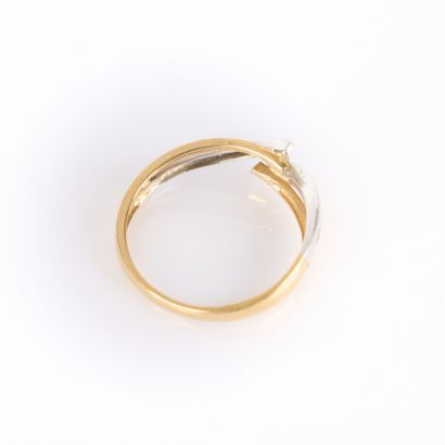 Two-tone gold cross ring set with a brilliant-cut...