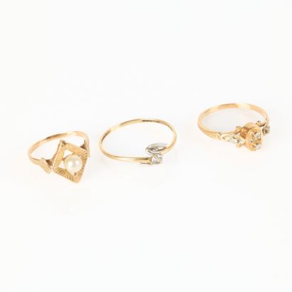 Three gold girls' rings set with pearls or...