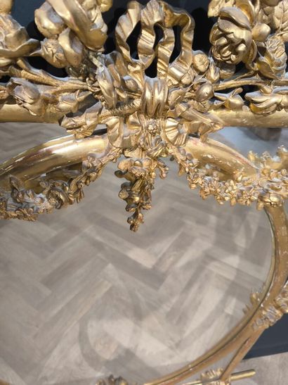 Wood and gilded stucco glazed mirror, decorated...