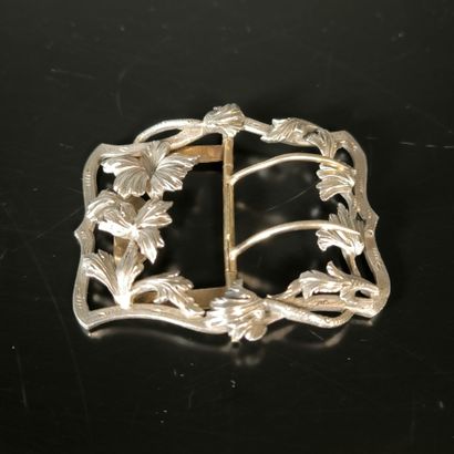 Silver belt buckle decorated with flowers,...