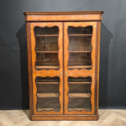 . Veneered display case with two glass doors,...