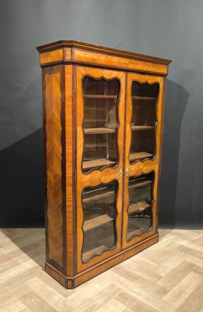 . Veneered display case with two glass doors,...
