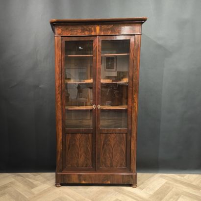 Mahogany and mahogany veneer bookcase, opening...