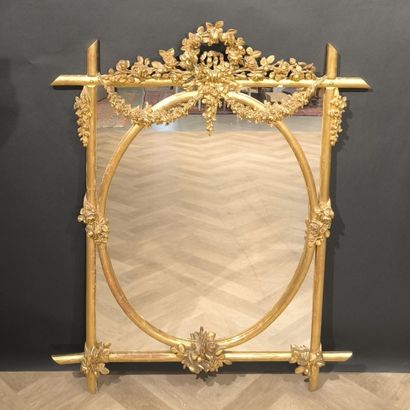 Wood and gilded stucco glazed mirror, decorated...
