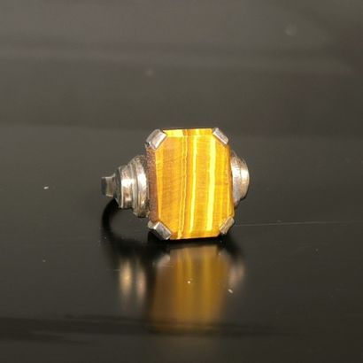 Silver ring set with a tiger's eye plate....