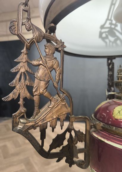 Curious metal suspension decorated with skiers,...