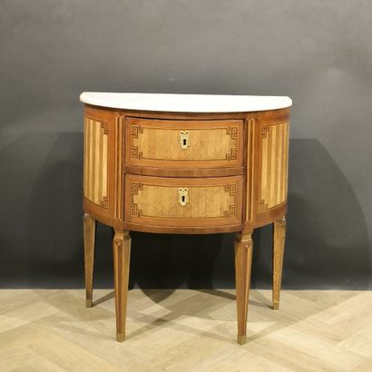 . Small inlaid half-moon chest of drawers,...