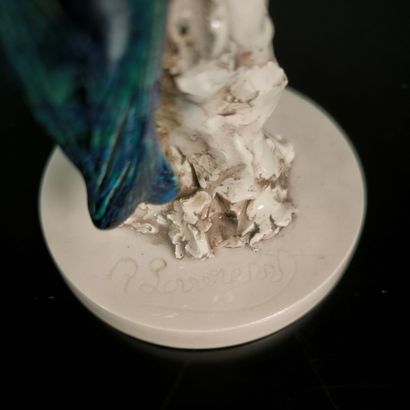Kingfisher in polychrome porcelain. Signed....