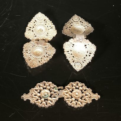 Set of three silver cape buckles or coat...