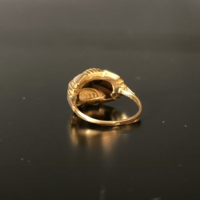 Gold ring set with a white stone. Circa 1940-50....