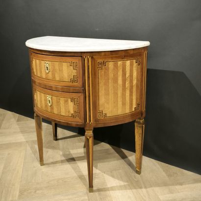 . Small inlaid half-moon chest of drawers,...