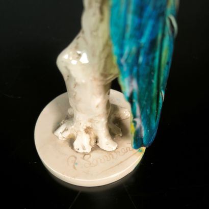 Polychrome porcelain parrot. Signed. Height:...