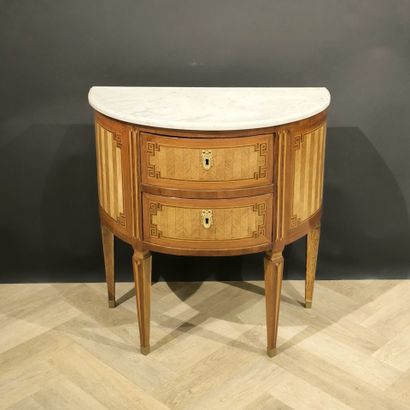 . Small inlaid half-moon chest of drawers,...